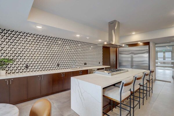 Aspire at Echelon apartments great room with community kitchen and dining bar.