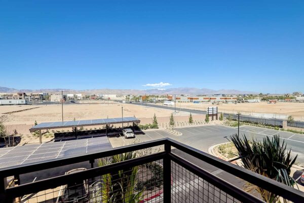 Aspire at Redwood apartment balcony overlooking Las Vegas and desert landscape.