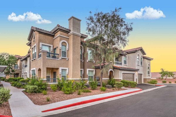 Altessa apartments with lush landscaping, large balconies, and garages.