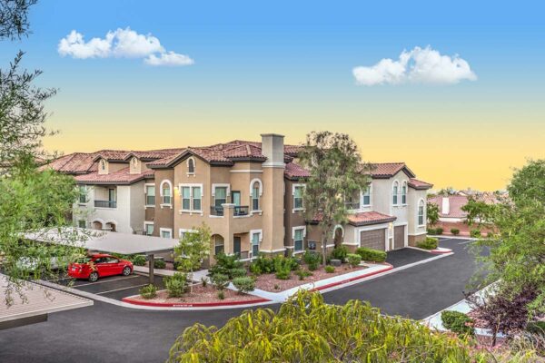 Altessa apartments with lush landscaping, large balconies, and garages.
