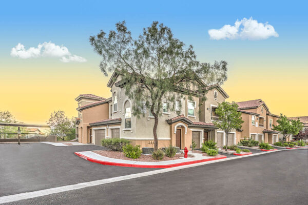 Altessa apartments with lush landscaping, large balconies, and garages.