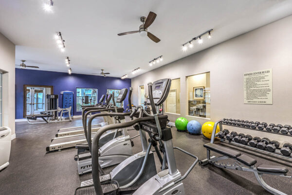 Fitness center with weight equipment and cardio machines.