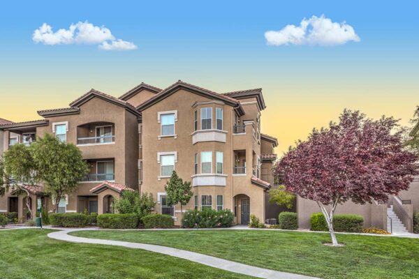Altessa apartments with lush landscaping, large balconies, and concrete pathways.