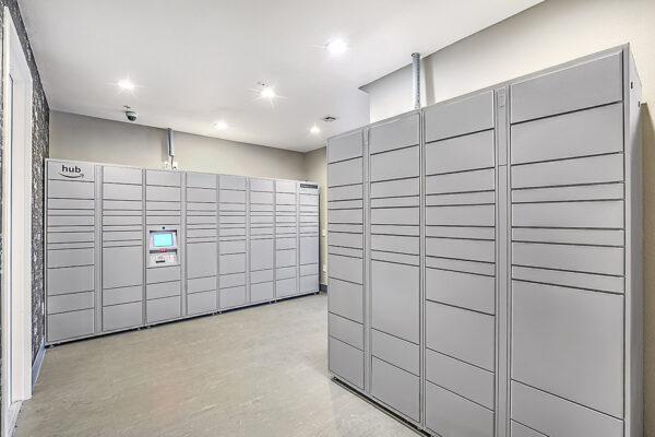 Mail room with grey mailboxes and Amazon hub packages lockers.