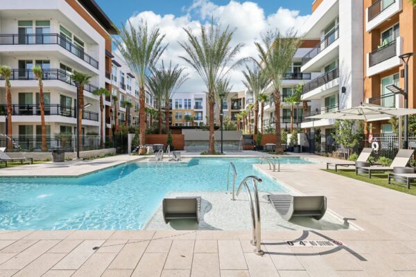 Aspire at Redwood Las Vegas Apartments Outdoor Pool Deck Seating In Water