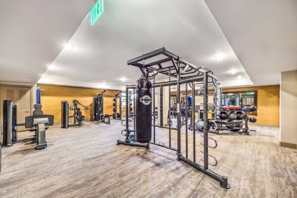 Fitness center with cardio machines and weight equipment.