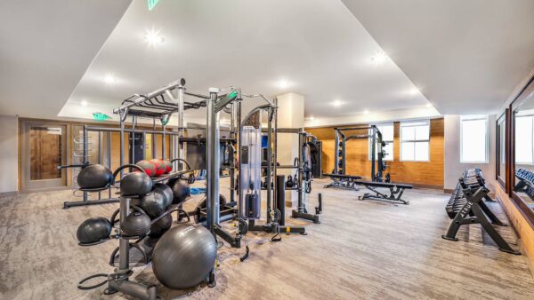 Fitness center with cardio machines and weight equipment.