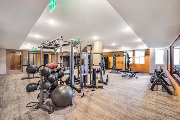 Fitness center with cardio machines and weight equipment.