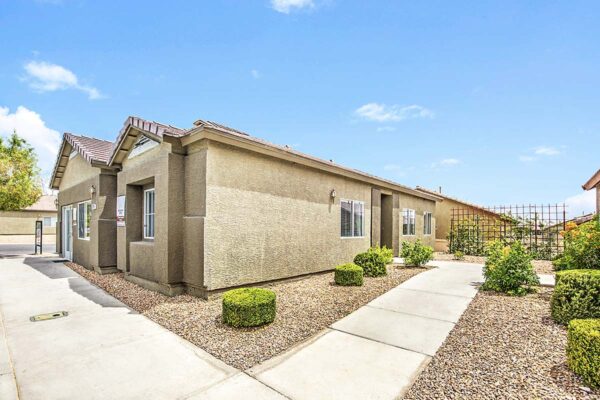 Diamond Vista apartments with paved walkways and lush landscaping.