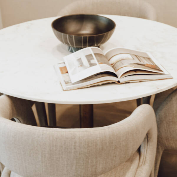 A table and chair in a community space at Aspire at Echelon.