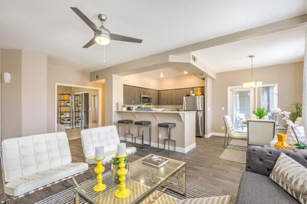 Living area with modern kitchen, plush seating area, and comfortable dining area.