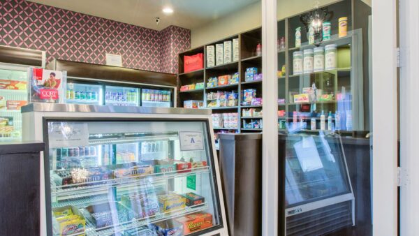 Snack bar with selection of candy bars, drinks, and frozen goods.