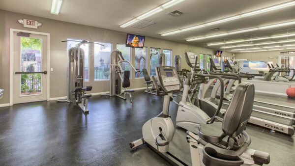 Fitness center with cardio machines and weight lifting equipment.