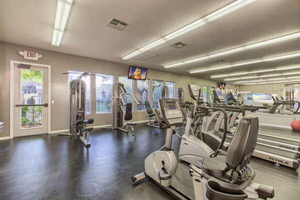 Fitness center with cardio machines and weight lifting equipment.