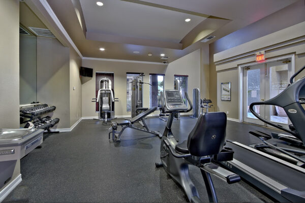 Fitness center with cardio machines and weight equipment.