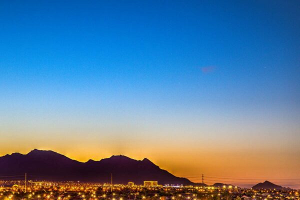 View of mountains surrounding Las Vegas city at dusk from Tesora apartments.