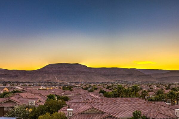 View of mountains surrounding Las Vegas city at dusk from Tesora apartments.