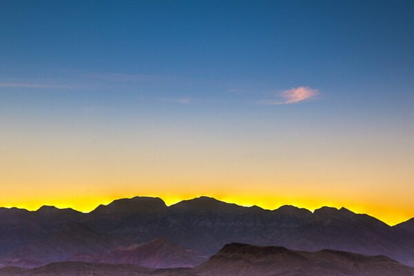 View of mountains surrounding Las Vegas city at dusk from Tesora apartments.