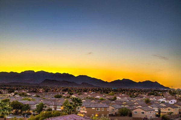 View of mountains surrounding Las Vegas city at dusk from Tesora apartments.