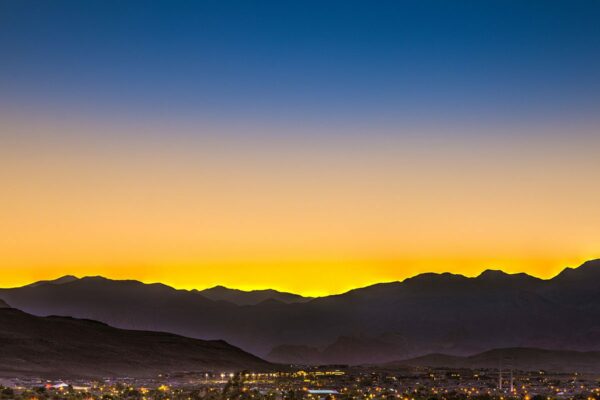 View of mountains surrounding Las Vegas city at dusk from Tesora apartments.