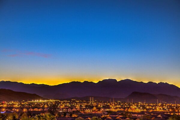 View of mountains surrounding Las Vegas city at dusk from Tesora apartments.