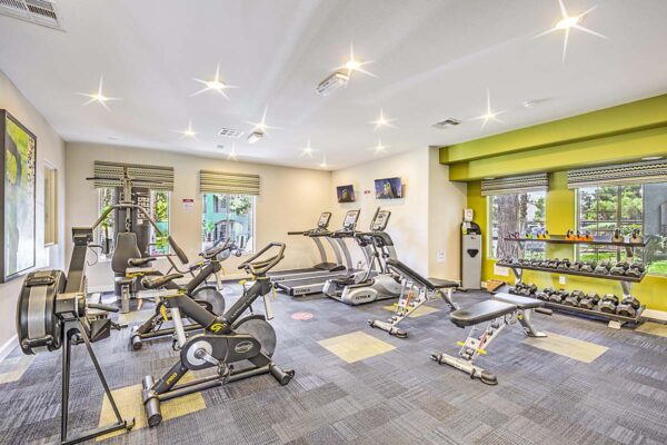 Fitness center with cardio machines and weight equipment.