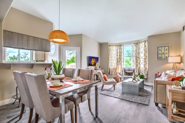 spacious Summerlin apartment living area with elegant dining area and comfortable seating room with TV.