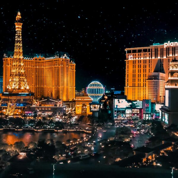 Las Vegas Strip at night with shining lights and tall buildings.