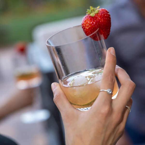 Cocktail glass with drink and strawberry.