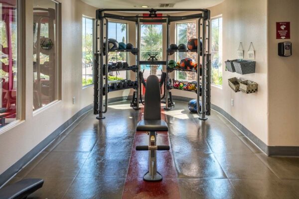 Arzano apartments fitness center with weight equipment.