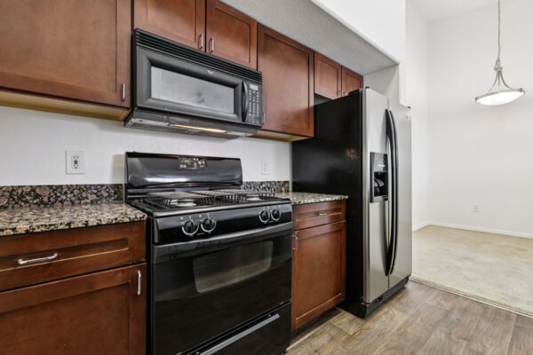 Altessa-Apartments-Unit-3141-Kitchen-Stove-and-Fridge-and-Dinning-Room