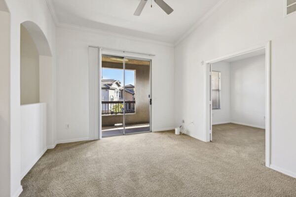 Altessa-Apartments-Unit-3141-Living-Room-With-Sliding-Glass-Door-and-Bedroom-View