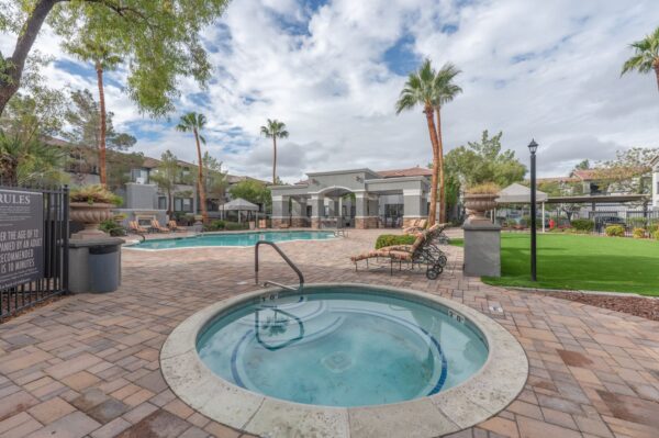 Positano-Apartments-Las-Vegas-Pool-and-Spa-Area-With-Loungers-and-Grassy-Area