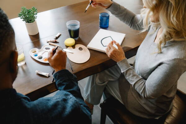 Two people painting