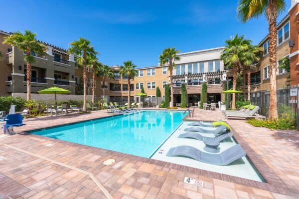 Radiance-at-Grand-Canyon-Senior-Apartments-Las-Vegas-Pool-Area-With-Loungers